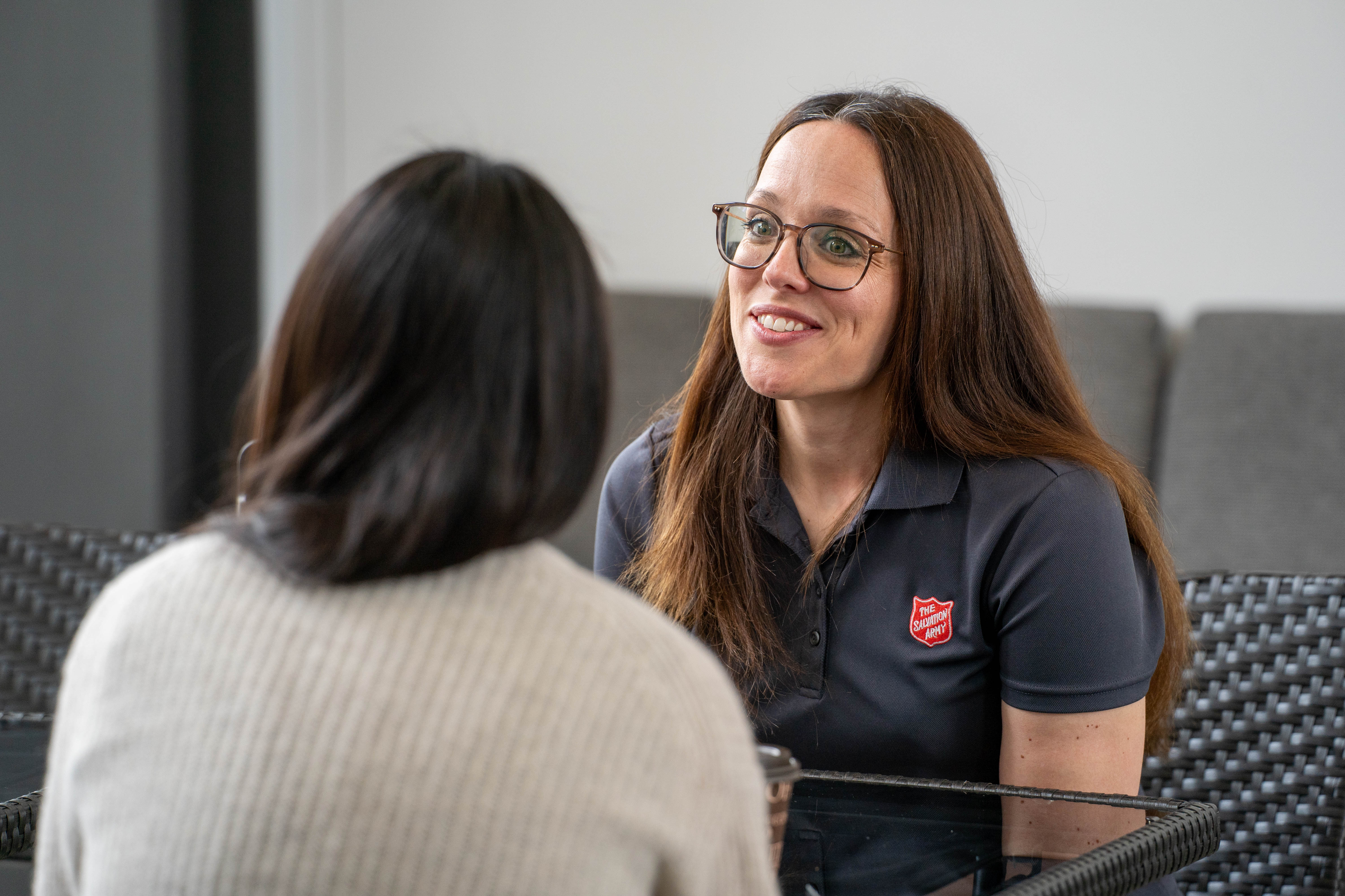 A person talking with a client for donations