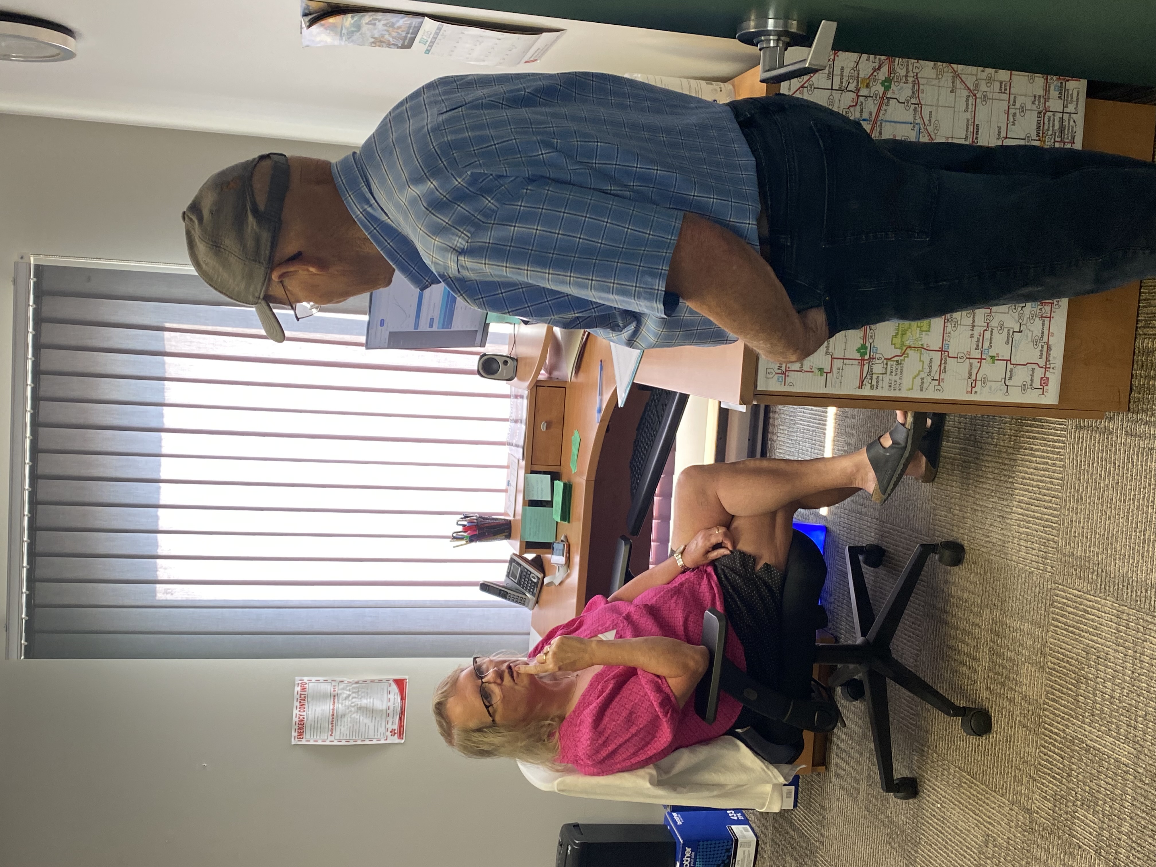 Two people talking in an office
